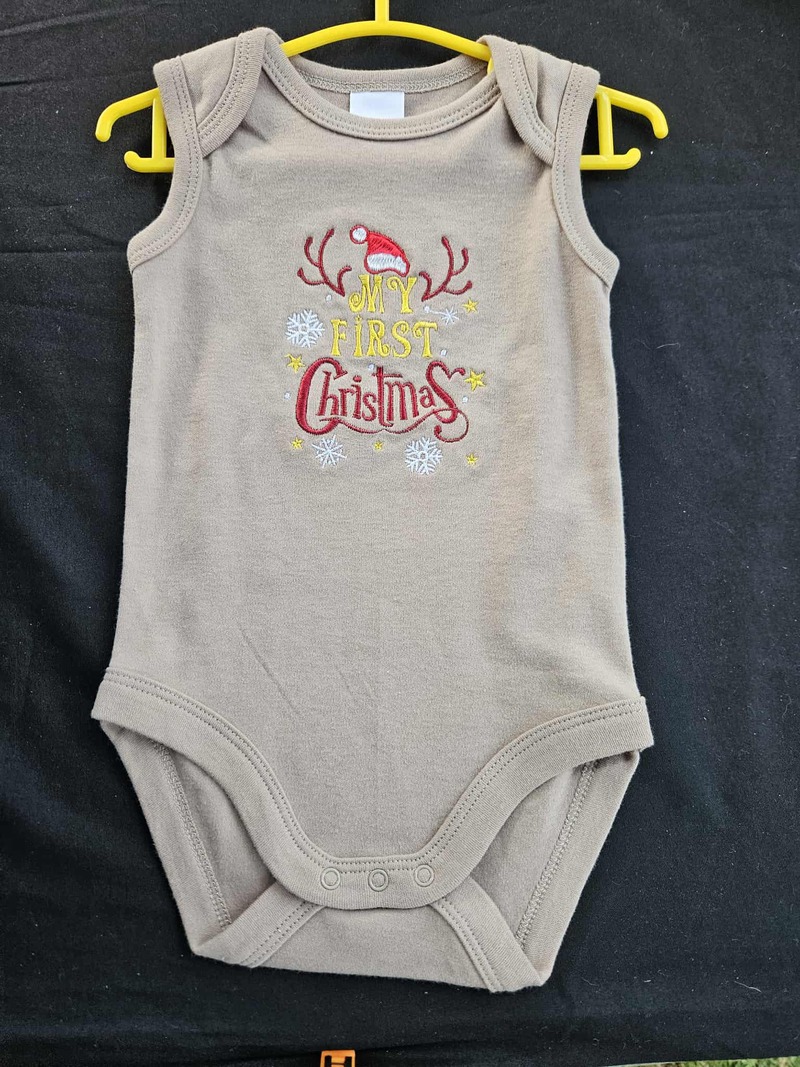 1st Christmas Onesie $20 Sizes 000-2 Short Sleeves or singlet.  White, Black, Tan, Blue or Pink